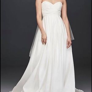 Pleated strapless wedding dress with empire waist.